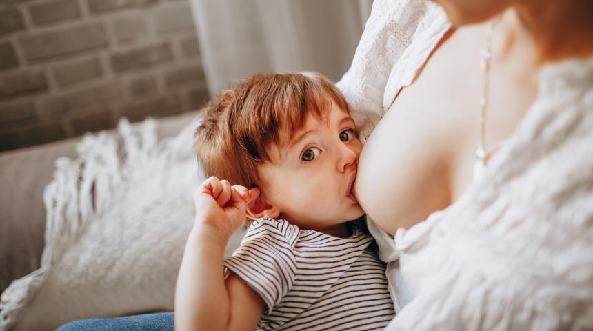 mother feeding toddler